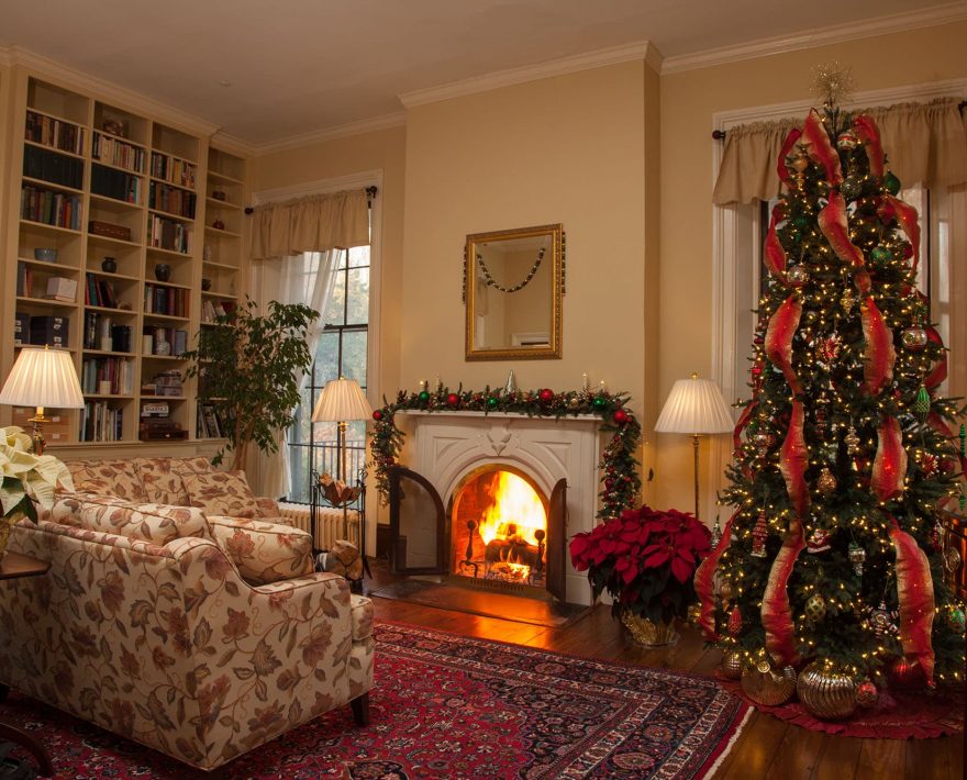 Living room with fireplace and festive tree